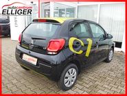 schwarzer Citroën C1 gelb beklebt