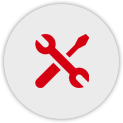 Rotes Symbol eines Schraubendrehers und eines Schraubenschlüssels (überkreuz) vor einem grauen kreisförmigen Hintergrund
